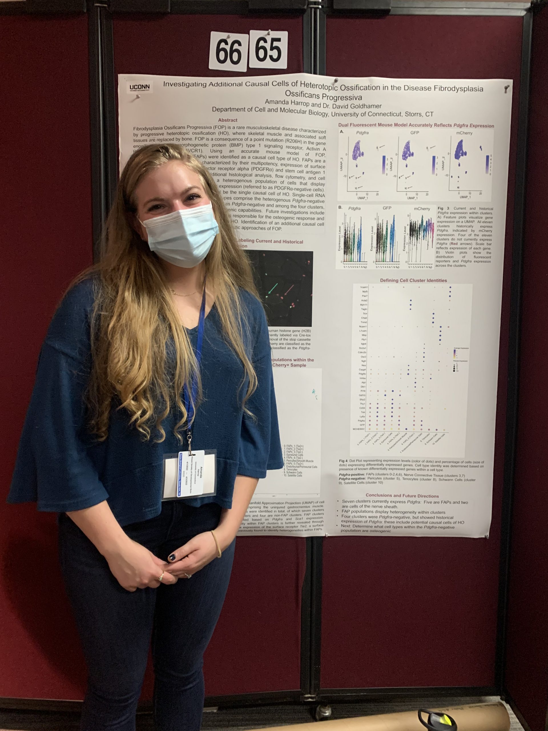 Amanda posing with her poster at the NESDB conference