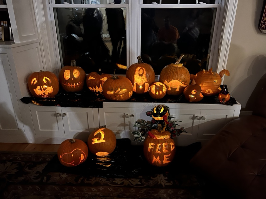 Display of all of the candle-lit pumpkins at the annual pumpkin carving contest. Lots of artistic talent on display!